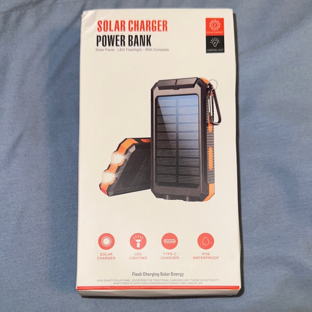 Solar Charger Power Bank - Black & Orange with the charger, clip also included!
